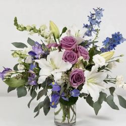 Emilees Flowers - A customer favorite lavender roses white lilies and blue delphinium