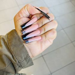 Queeny Nail Salon - I love my nails. My nail tech never disappoint. I've always gotten my nails long & they last about a month or more.