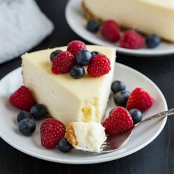 The Olive Leaf - New York Style Cheesecake with fruit and Triple Berry Balsamic Reduction