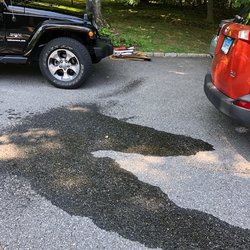 County Waste - Oil Stain left by truck (the cars weren't there at the time)