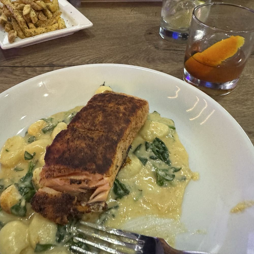 Pure Social Bar & Grill - Salmon with gnocchi, honey old fashioned and steak frites. - Sports Bars Near Me - Richardson, Texas Pure Social Bar & Grill - Salmon with gnocchi, honey old fashioned and steak frites. - Sports Bars Near Me - Richardson, Texas