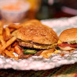 Five Guys - Cheeseburger with jalapenos and mushrooms Cheese dog with onions and relish Cajun Fries