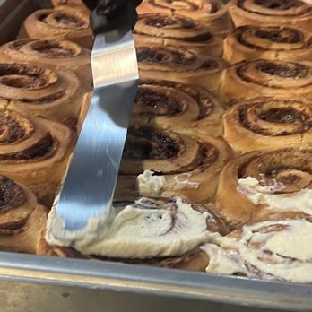 Soleluna - Frosting the cinnamon buns! - Bakeries Near Me - Washington, DC, District of Columbia