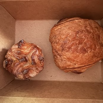 La Fillette Bakery - Kouign Amman with chocolate croissant for scale - Bakeries Near Me - Denver, Colorado La Fillette Bakery - Kouign Amman with chocolate croissant for scale - Bakeries Near Me - Denver, Colorado