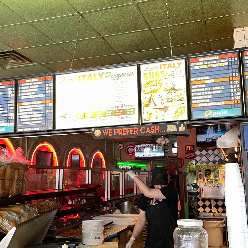 Little Italy - a man working in a fast food restaurant - Pizza Near Me - Athens, Georgia