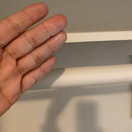 The dust on the shelf after supposedly cleaning the place by his wife