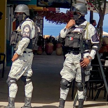 Caffé del Mar - Just when you think of letting your guards down, these fierce soldiers w AK15? or AK 47? There might be cholos here!! - Coffee & Tea Near Me - Puerto Vallarta, JAL
