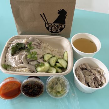 Rooster & Rice - The Original with no skin + Chicken Broth Extra side of chicken thigh Sriracha, KMG, Ginger Scallion sauce - Thai Near Me - Costa Mesa, California Rooster & Rice - The Original with no skin + Chicken Broth Extra side of chicken thigh Sriracha, KMG, Ginger Scallion sauce - Thai Near Me - Costa Mesa, California