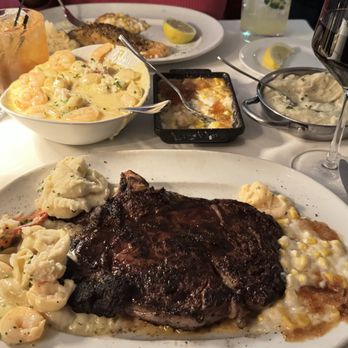 Steak 48 - Salmon, Bone in ribeye, lobster and shrimp Mac and cheese, corn brûlée, and mashed potatoes with a glass of Chardonnay - Steakhouses Near Me - Chicago, Illinois