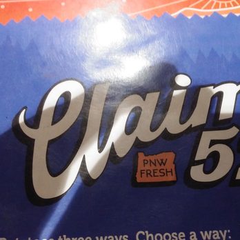 Claim 52 Kitchen - the name of the restaurant - A close-up image of a menu or poster featuring the text 'Claim 52' with a 'PNW FRESH' sticker, set against a colorful background. - Gastropubs Near Me - Eugene, Oregon