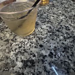 M Bar Sports Lounge - Premium liquor in a plastic cup.