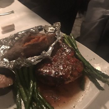 River's Bend - Bacon wrapped Pork Chops and a fabulous sweet Potato. - Seafood Near Me - Green Bay, Wisconsin
