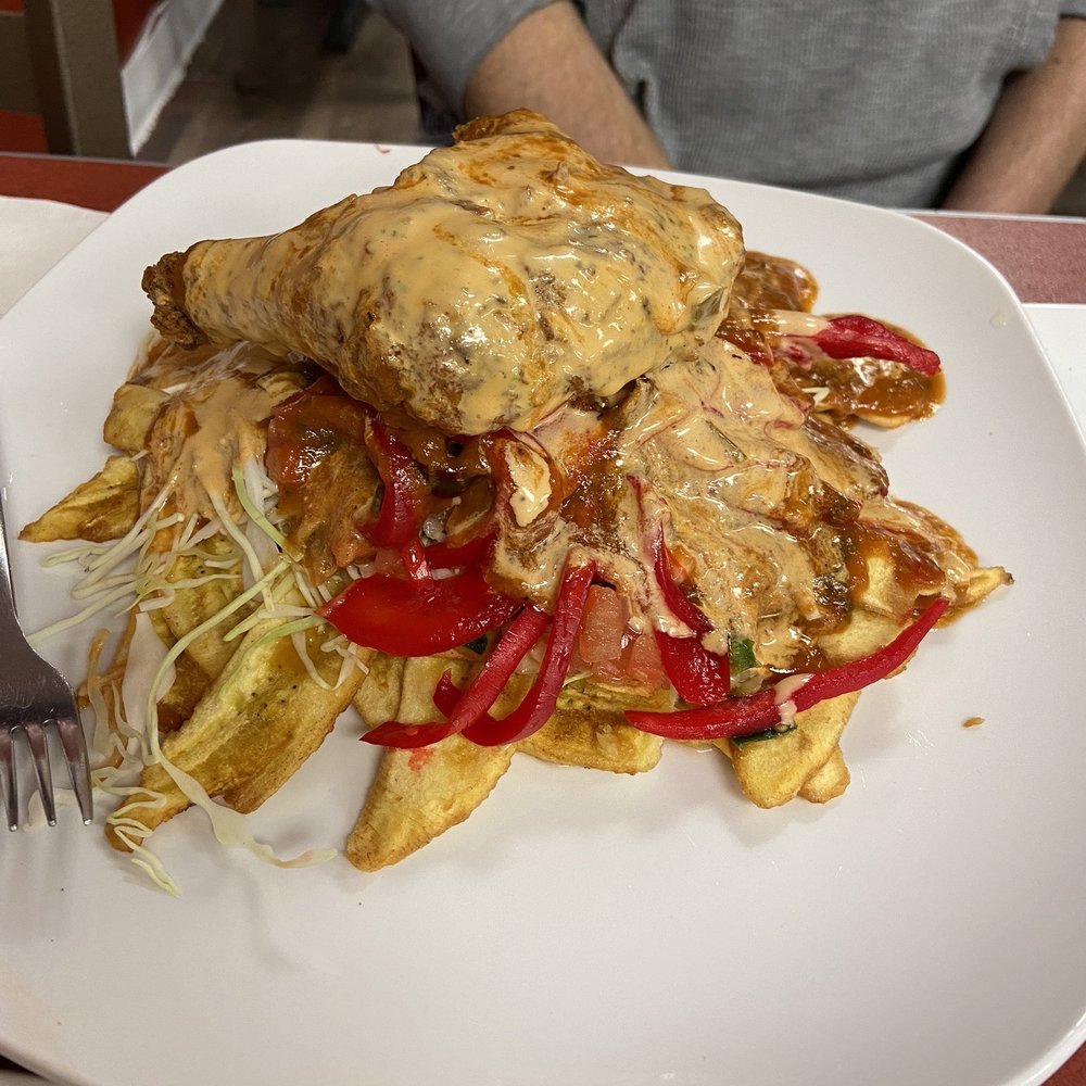 Sabor K-tracho Restaurant - The fried chicken dish. (The red is the pickled onions, yummmy.) - Honduran Near Me - Maryland Heights, Missouri Sabor K-tracho Restaurant - The fried chicken dish. (The red is the pickled onions, yummmy.) - Honduran Near Me - Maryland Heights, Missouri