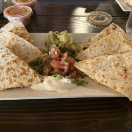 Great service. Chips were homemade. Salsa delicious. Quesadillas were so large. And tasty.