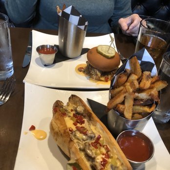 Hootch and Banter - Non-gluten-free sandwich in foreground - New American Near Me - Frederick, Maryland Hootch and Banter - Non-gluten-free sandwich in foreground - New American Near Me - Frederick, Maryland