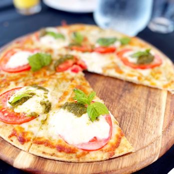Bamboo Island Bar - a pizza on a wooden board - Wine Bars Near Me - Bradenton Beach, Florida Bamboo Island Bar - a pizza on a wooden board - Wine Bars Near Me - Bradenton Beach, Florida