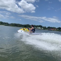 NSB Jet Ski - Young girl riding a yellow JetSki.
