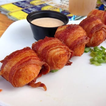 Coconuts On The Beach - Bacon wrapped scallops. I don't know how they do it but the scallop and bacon are corked perfectly. - Bars Near Me - Cocoa Beach, Florida Coconuts On The Beach - Bacon wrapped scallops. I don't know how they do it but the scallop and bacon are corked perfectly. - Bars Near Me - Cocoa Beach, Florida