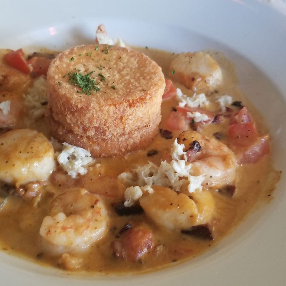 Madison's - Seafood and fried grit cakes smothered in smokey gam gravy - Seafood Near Me - Port Royal, South Carolina Madison's - Seafood and fried grit cakes smothered in smokey gam gravy - Seafood Near Me - Port Royal, South Carolina
