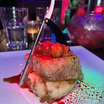 Beetle House - Steak with fake blood and fake knife - New American Near Me - New York, New York Beetle House - Steak with fake blood and fake knife - New American Near Me - New York, New York