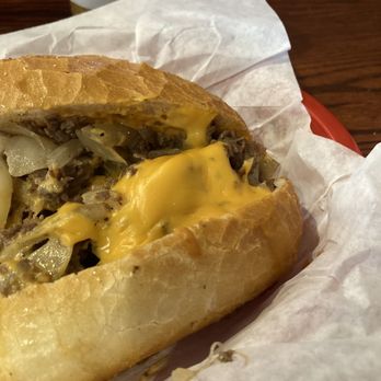 Tat's Delicatessen - Beef Cheesesteak whiz and with onions - Delis Near Me - Seattle, Washington Tat's Delicatessen - Beef Cheesesteak whiz and with onions - Delis Near Me - Seattle, Washington