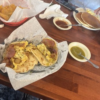 Hermanos Taqueria & Bakery - Two breakfast tacos and a pancake breakfast platter - Tex-Mex Near Me - Luling, Texas Hermanos Taqueria & Bakery - Two breakfast tacos and a pancake breakfast platter - Tex-Mex Near Me - Luling, Texas