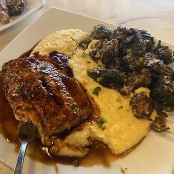 District Bar and Kitchen - Bourbon salmon cheddar grits and fried Brussel sprouts - Bars Near Me - Ocala, Florida