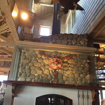 Flying Beaver Bar - Fireplace with the "Flying Beaver" icon and stuffed bald eagle - Pubs Near Me - Richmond, British Columbia Flying Beaver Bar - Fireplace with the "Flying Beaver" icon and stuffed bald eagle - Pubs Near Me - Richmond, British Columbia