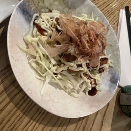 Tako yaki Fried cakes with octopus, Marinated fried chicken, cucumber, mayo, smoked apple BBQ sauce, spring mix & spicy mayo bonito flakes