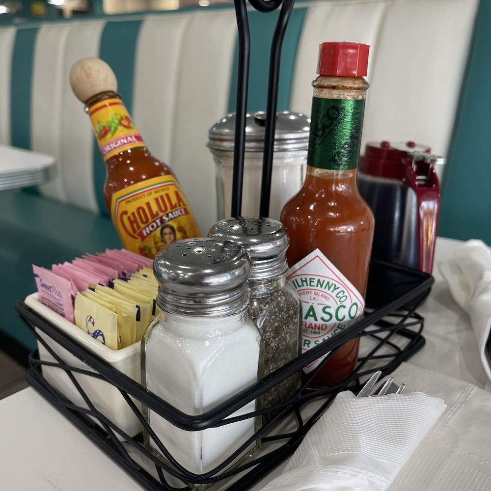 a table with condiments and condiments a table with condiments and condiments