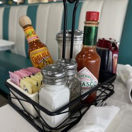 a table with condiments and condiments a table with condiments and condiments