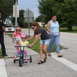 Busy Bee Early Learning Center - Heart award bike ride with officer Joe.