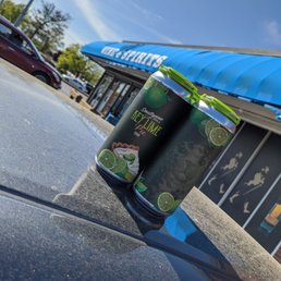 two cans on the hood of a car two cans on the hood of a car