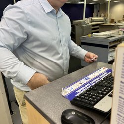 FedEx Office Print & Ship Center - Kevin (store manager) removing his name tag and holding it in his hand when I asked for his name.