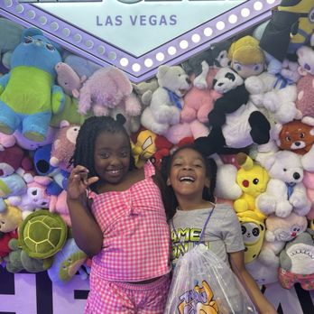The Claw Arcade - Kids posing In front of the plushie wall - Arcades Near Me - Las Vegas, Nevada The Claw Arcade - Kids posing In front of the plushie wall - Arcades Near Me - Las Vegas, Nevada