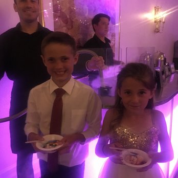 Sensational Treats - Our adorable ring bearer and flower girl enjoying the delicious liquid nitrogen ice cream! - Caterers Near Me Sensational Treats - Our adorable ring bearer and flower girl enjoying the delicious liquid nitrogen ice cream! - Caterers Near Me