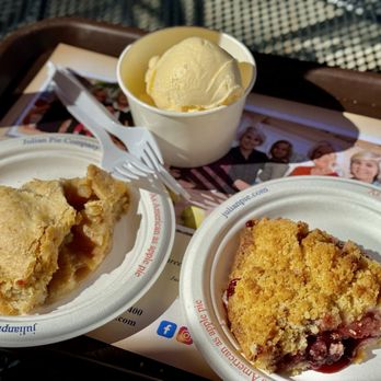 Julian Pie Company - Slices of the natural apple and boysenberry apple crumb pies, along with a scoop of ice cream on the side. - Bakeries Near Me - Julian, California Julian Pie Company - Slices of the natural apple and boysenberry apple crumb pies, along with a scoop of ice cream on the side. - Bakeries Near Me - Julian, California