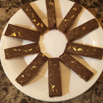 Jeff's Artisan Bakeshop - a white plate with chocolate bars on it - Bakeries Near Me - Upton, Massachusetts Jeff's Artisan Bakeshop - a white plate with chocolate bars on it - Bakeries Near Me - Upton, Massachusetts
