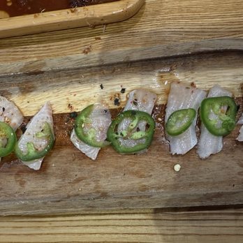 Aikan Sushi - "Sashimi". Added the pencil for size reference. Basically, they take one piece of fish and slice it into either two or four pieces. - Izakaya Near Me - Northridge, California