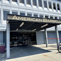 Pickup parking is located on the right side of the building.