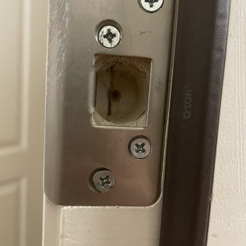 Krasiva Windows and Doors - This is a builder installed door. Notice they did not drill completely through the frame. - Windows Installation Near Me - Phoenix, Arizona