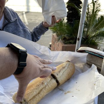 John's Philly Grille - Look how BIG this thing is!  Now... my fingers measure 9" from thumb to end of middle finger... this 12" sandwich is more like 15" long! - Sandwiches Near Me - Huntington Beach, California
