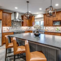 Reico Kitchen & Bath - Woods and Grays come together in this kitchen design.