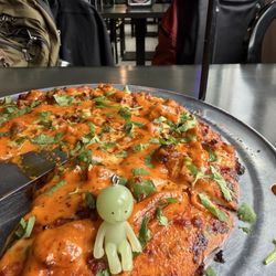 Bombay Curry Pizza - Smiski Steve enjoying butter chicken pizza.