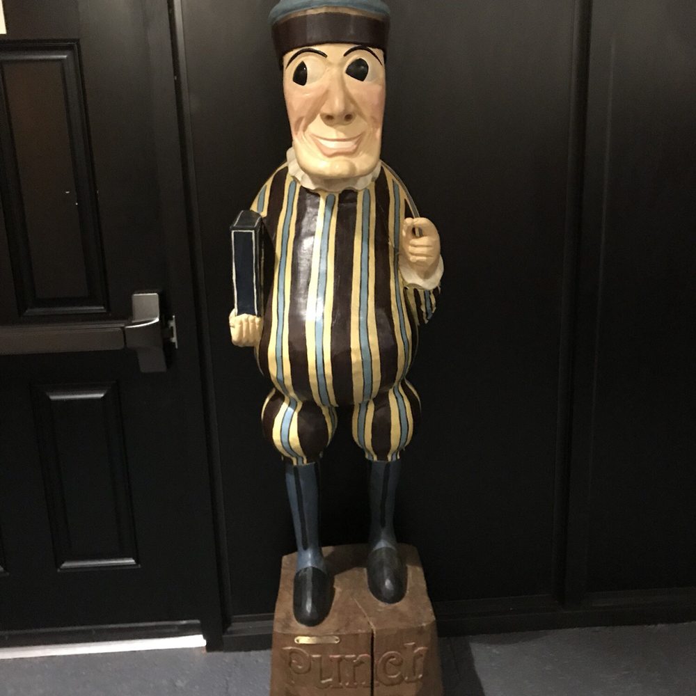 a statue of a man with a hat on his head a statue of a man with a hat on his head