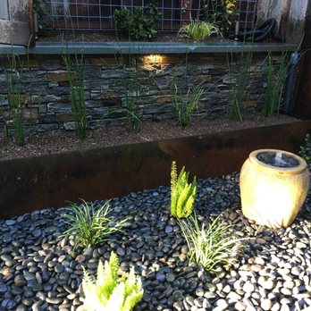 Sargent Landscaping - rock garden with fountain and hidden sump pump. Rusted steel planter. Rock faced Wall - Landscaping Near Me - Novato, California Sargent Landscaping - rock garden with fountain and hidden sump pump. Rusted steel planter. Rock faced Wall - Landscaping Near Me - Novato, California