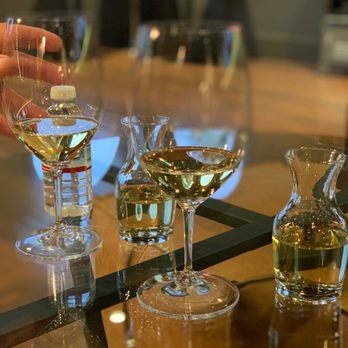Cloak & Dagger Wines - a person holding a glass of wine - Wineries Near Me - Paso Robles, California