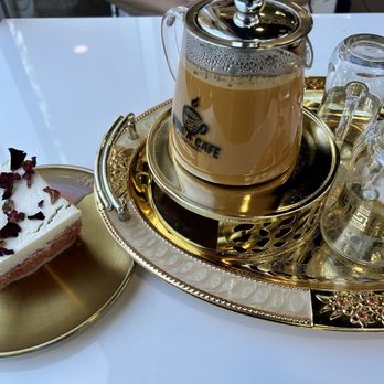Sana'a Cafe - Rose milk cake and small pot of Adeni chai - Coffee & Tea Near Me - Lake Forest, California Sana'a Cafe - Rose milk cake and small pot of Adeni chai - Coffee & Tea Near Me - Lake Forest, California
