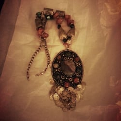A Galerie - The photo in no way truly captures the beauty of this piece, but there are so many different colored jewels that it just love it