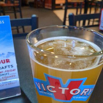 Cap'ns Corner - a glass of beer on a table - New American Near Me - Woodbury, New Jersey